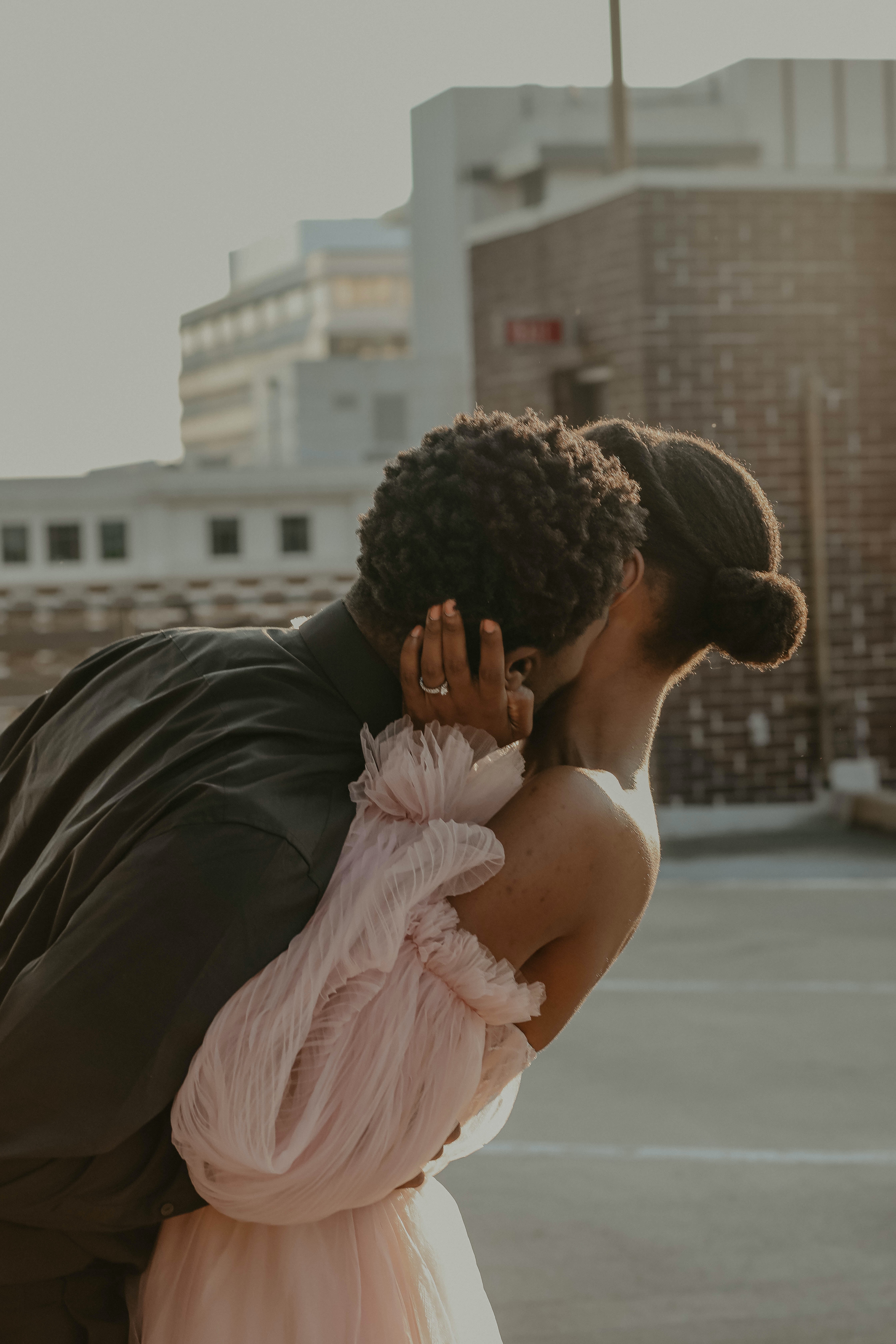 A couple sharing a quiet moment on a rooftop